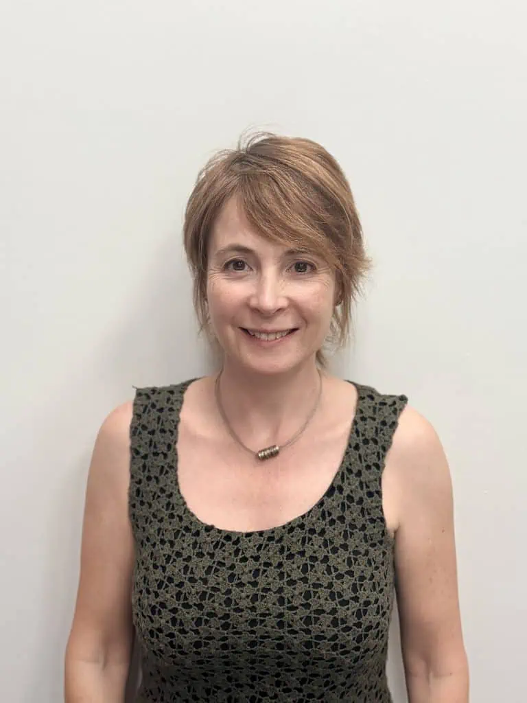 Woman smiling, representing Kings School governors.